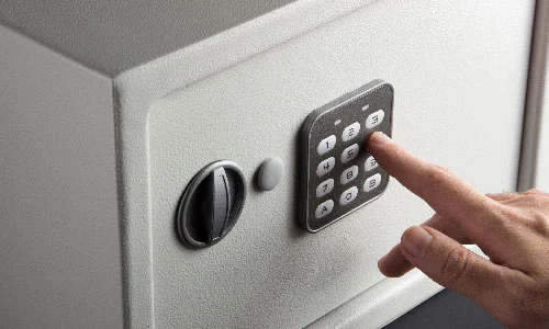 Hand entering in a code for a high security lock