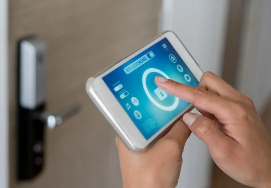 A person uses an app to unlock a door