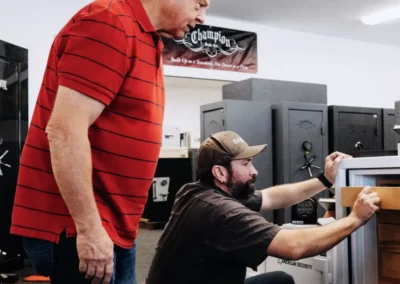 A customer inspects a safe interior