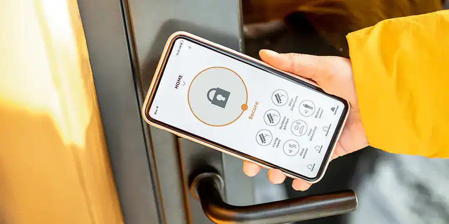 A homeowner opens a smart lock with a mobile phone